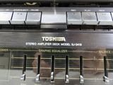 a close up of a stereo player with many knobs on it