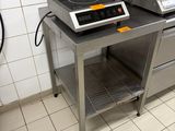 a kitchen with a stove and a counter with a stove top