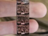 a person holding a piece of film in their hand