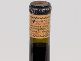 a bottle of wine that is sitting on a table