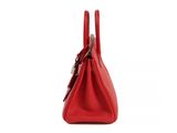 a red handbag on a white background