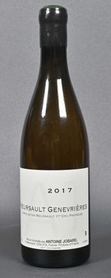 a bottle of wine that is sitting on a table