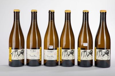 six bottles of wine are lined up in a row