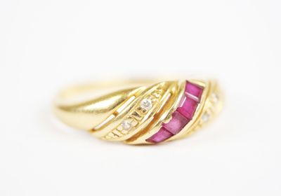 a close up of a gold ring with a pink stone and diamonds