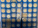 a lot of blue boxes of soap sitting on a shelf