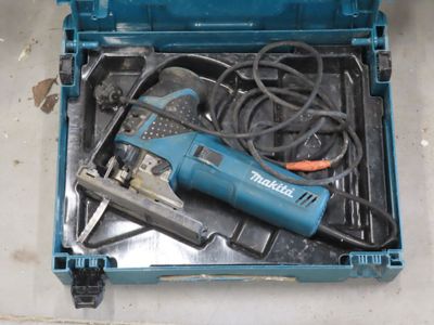 a blue tool box with a drill and other tools in it