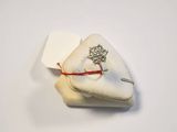a ring that is sitting on top of a pillow
