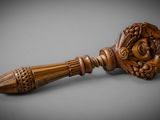 an image of a wooden handle with a face on it
