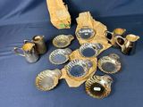 a pile of silverware on a blue cloth