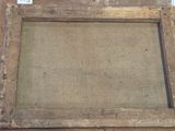 an old wooden picture frame with a piece of burlock paper on it