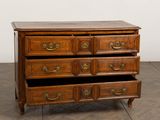 an image of a wooden chest of drawers in a room