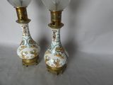 two lamps that are sitting next to each other on a table