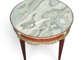 an image of a marble topped table with a red and gold trim