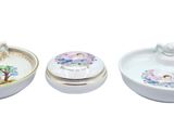 three bowls and a bowl with a lid on a white background