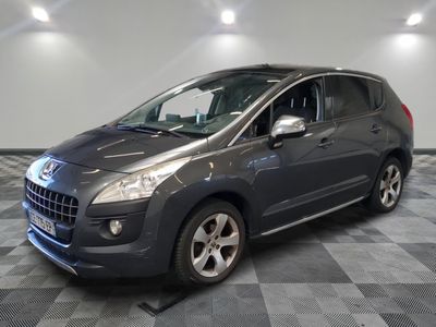 a picture of a grey car parked in a showroom