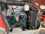 a small engine in the back of a truck
