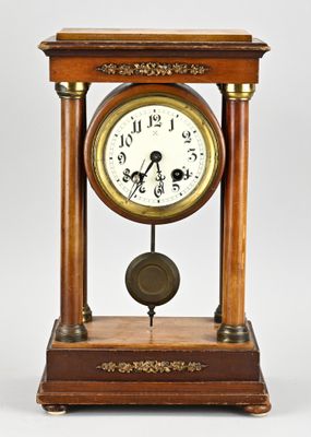 a wooden clock that is sitting on a table