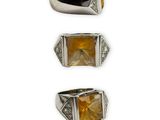 three different rings with yellow and white diamonds on a white background