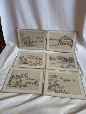 six dessins encadrés représentant des montagnes et des arbres sur une feuille de papier