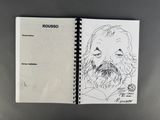 drawing of a man with a beard and mustache in a notebook