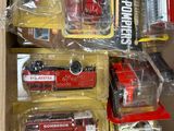 a lot of toy fire trucks in a box