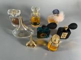 a lot of small bottles of perfume sitting on a table
