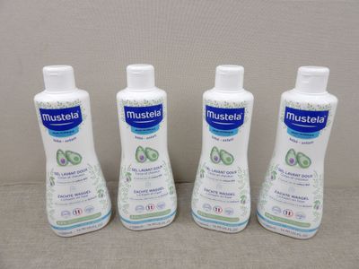 three bottles of mouthwash sitting next to each other on a table