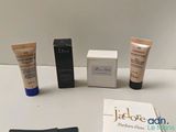 three different types of makeup products on a table