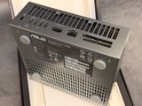 a close up of a silver electronic device sitting on top of a table