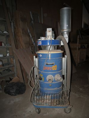 a blue machine that is sitting in a room