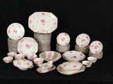 a lot of plates and bowls on a black table