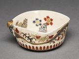 an image of a small bowl with a flower design on it