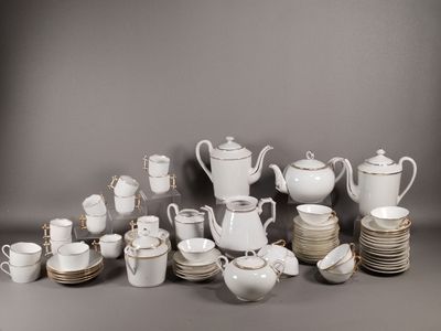 an image of a group of white and silver dishes and cups