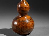 an old wooden gourd sitting on top of a table