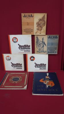 a lot of books on a table with a red background
