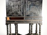 an old wooden cabinet with carvings on the doors and drawers