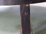 a close up of a chair with a black and green seat