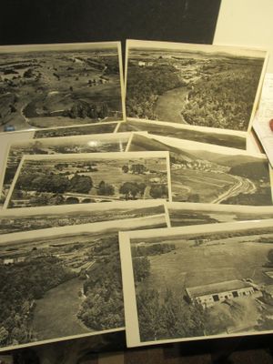 several black and white photos of a table with a bunch of pictures on it