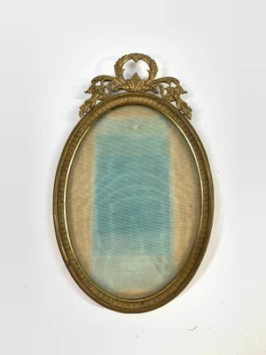 an old picture frame with a blue and white stripe in it