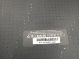 the back of a laptop with a sticker on it ' s side
