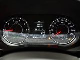 a close up of a car dashboard with a speedometer and gauges