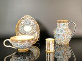 three different types of tea cups and saucers on a table