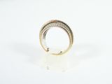 an image of a gold and silver ring on a white surface