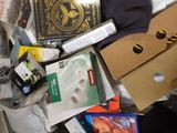 a pile of assorted items on the floor of a room