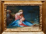 une image d'une peinture représentant une femme tenant un bébé sur ses genoux