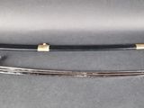 an image of a pair of swords sitting on top of a table
