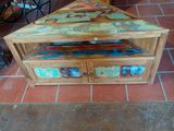 a wooden table with a drawer underneath it on a tiled floor