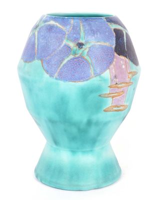 a blue vase with a picture of a woman on it