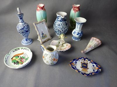 a lot of small vases and plates that are on a table