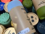 many different types of coffee cups in a basket